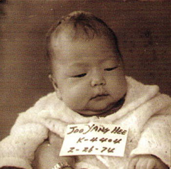 Abandoned at a police station in South Korea, this baby was adopted by her U.S. parents in 1974. (Rainbow World)